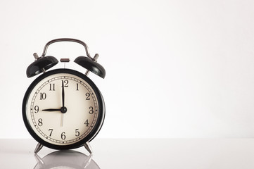 Close up alarm clock on white background