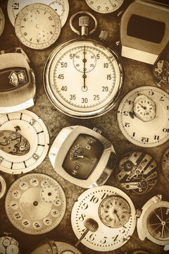 Sepia toned image vintage rusty watches and parts
