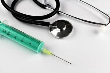 An image of stethoscope and a syringe