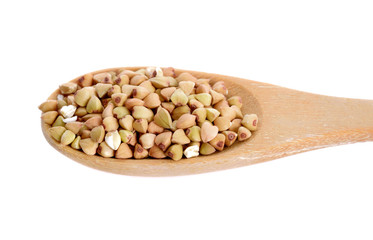 Buckwheat in wooden spoon  isolated on white background