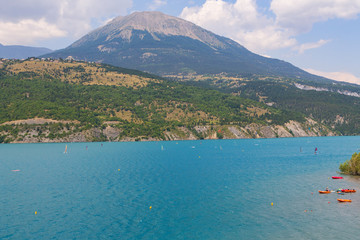 Panoramic view of the beautiful blue lago di Serre-Poncon in the alps