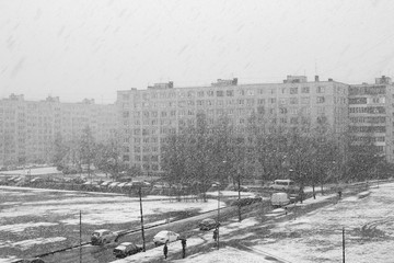Snow in St. Petersburg, sleeping area. Spring, April. Black and white image.