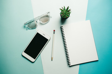 Creative flat lay photo of workspace desk with smartphone ,  minimal style