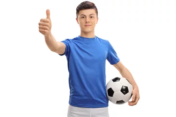 Foto op Canvas Teenage football player making a thumb up sign © Ljupco Smokovski