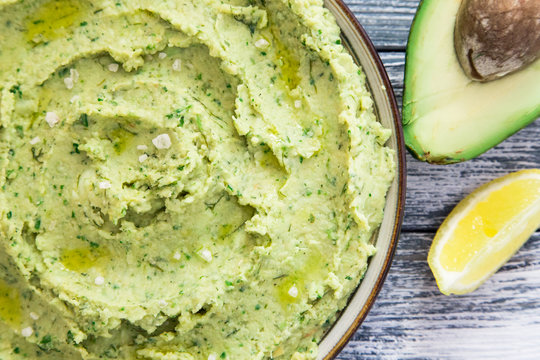 Healthy avocado hummus with olive oil. vegetarian concept. selective focus