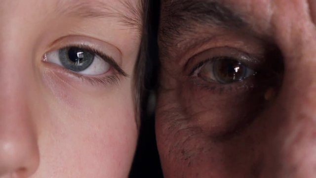  Old and young eye - Grandfather and grandson looking together at camera