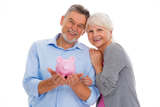 Senior Couple Holding Piggy Bank
