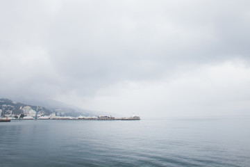 The promenade of Yalta. The port in the black sea. Cloudy weather on the black sea. The City Of Yalta- Crimea
