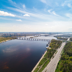 Fototapeta na wymiar Panoramic view of the city of Kiev in the spring. View of the Dnieper River and bridges across it. Aerial view, from above. Outdoor.