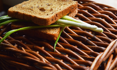 corn bread with green onions in a wicker basket