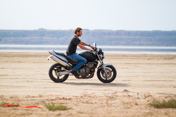 Fototapeta na wymiar motorcycle rider in desert 