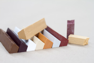 Colored wax for furniture restoration. Repair of furniture.