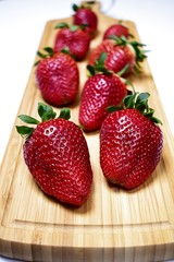 Strawberries on a wooden board.