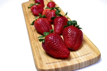 Strawberries on a wooden board.