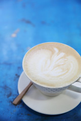 cappuccino coffee in blue vintage