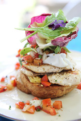 Eggs benedict with grilled chicken and bread