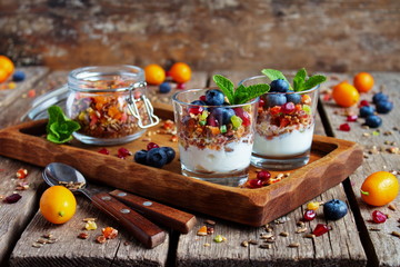 Naklejka na ściany i meble Homemade granola with yogurt for Breakfast