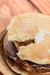 Closeup macro of american pancakes stuffed with chocolate cream on the plate