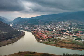 Fototapeta na wymiar View from Jvari Monastery on Mtskheta, eastern Georgia.It is listed as a World Heritage site by UNESCO. Spring in Georgia.