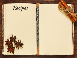Opened cookbook and spices