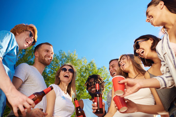 Joyful friends having fun and relax on sunny day