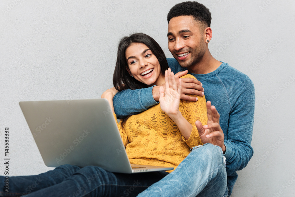 Sticker Man hugging woman with laptop