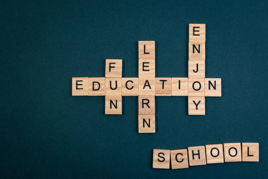 Wood block educaiton word over backboard school. Education word formed by educational wood block. Education word concept for background.