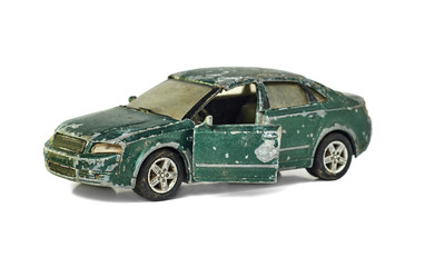 Shabby toy car isolated on white