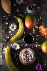 Tea party still ife with fruits and flowers vertical