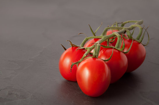 Cherry Tomato on the vine, slate table
