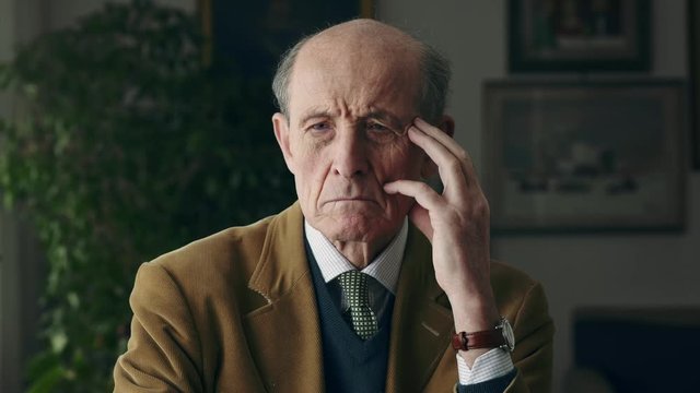 Worried and angry elderly man. Portrait of angry old man