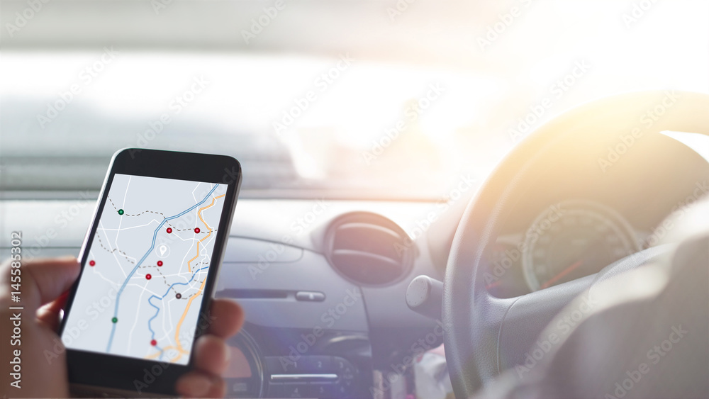 Fototapete hand using smartphone gps navigation inside car, all on mobile screen are designed up