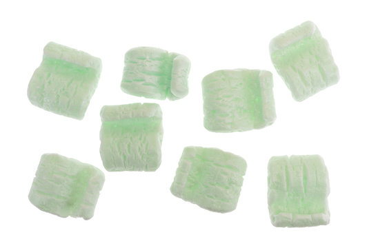 Several Green Packing Peanuts Isolated On A White Background.