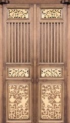 Ancient wooden door in an elegant Chinese culture.