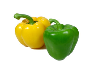 Close-up of yellow and green ripe vivid color bell peppers with stem isolated on white background
