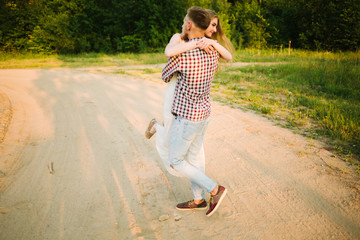 Beautiful Love story in the woods. Portrait of young stylish couple.