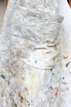 Detail of an apron of a painter with traces of oil painting