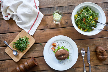 Fresh food on wooden table in restaurant