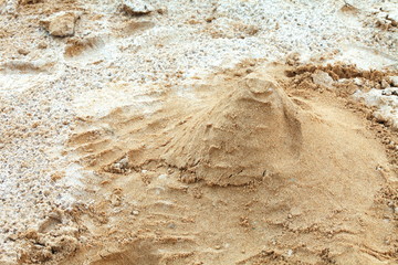  The small sand mountain with finger stain in the playground among daytime natural light.