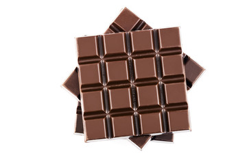 Three pieces of bitter, dark chocolate bar, isolated on white background, close-up, top view