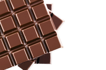 Three pieces of bitter, dark chocolate bar, isolated on white background, close-up, top view