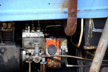 A detailed close up of an old vintage tractor engine.