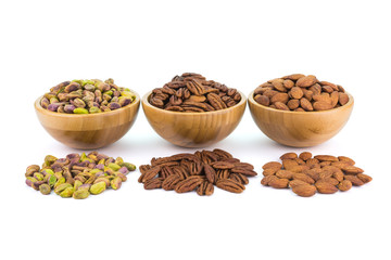 Fototapeta na wymiar Bowl with pistachio Pecan almonds and spread nuts