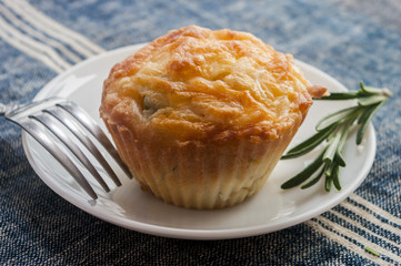 Savory cheese and bacon muffins on the wooden table