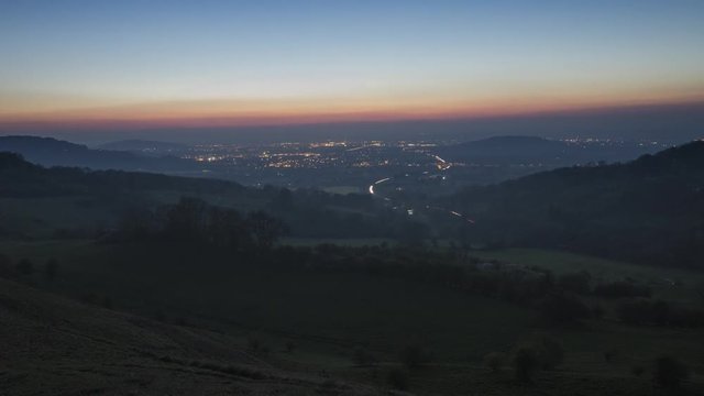 Twilight to Night Time Lapse Transition with City and Car Lights, Vale of Gloucester in United Kingdom