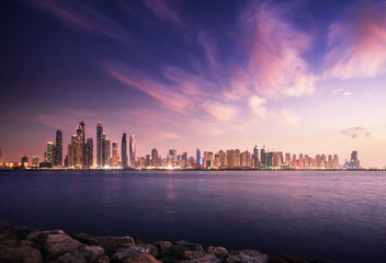 panorama of skyscrapers in Dubai Marina, sunset time, UAE