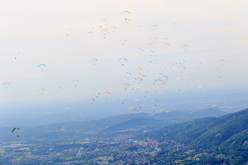 many paragliders on the sky