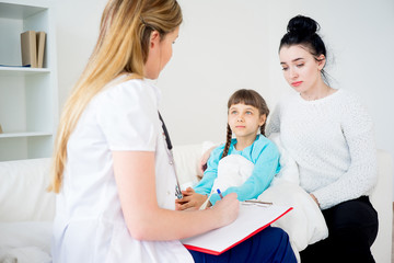 Fototapeta premium Doctor visiting sick girl