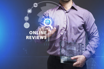 Business, Technology, Internet and network concept. Young businessman working on a virtual screen of the future and sees the inscription: Online reviews