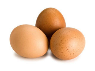 Three brown eggs, close up
